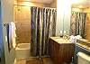 Guest bath with tub/shower.