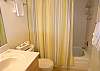 Guest bathroom adjacent to the guest bedroom & equipped with tub/shower.