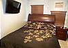Bedroom with queen size bed & flatscreen TV