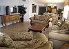 The furniture is all just so beautiful and comfortable too. The flooring is really tile, but it looks like wood. The balcony is off of the living area and the master bedroom.  Large cable TV/DVD/VCR.