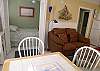 The double bed is tucked away for a little privacy. The window behind the bed faces the beach.