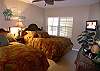 Second bedroom with two double beds, 26 inch LCD TV/DVD and adjoining bath with tub/shower.