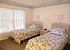 Guest bedroom with two twin beds.