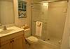 Second bathroom with tile shower.