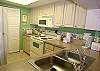 Updated galley kitchen with doors to the laundry room.