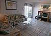 Living room with queen size sofabed, 27" TV, DVD player and sliding glass doors that open to the patio and waterway!