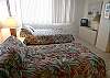 The bayfront guest bedroom has one queen size bed, one twin bed, cable TV/VCR, walk-in closet & adjoining bath with tub/shower.