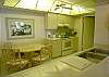 Kitchen with laundry room at the end.