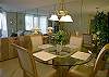 Four chairs surrounding the table and two additional dining chairs in the condo complete seating for six.