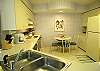Fully equipped eat-in kitchen with pass-thru to the dining area.