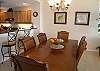 The dining table seats 6 and there are two additional barstools at the counter.