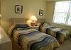 The guest bedroom has twin beds and an adjoining bathroom.