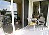 Sliding glass doors to the living room and master bedroom from the bayfront balcony.