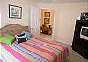 Guest bedroom with queen size bed, cable TV/VCR with FM radio and adjacent bath with tub/shower.