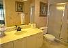 Guest bathroom with tile shower.