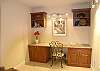 The den has a wonderful built-in desk and comfortable reading chair.