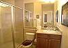 Third bathroom with tile shower