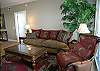 Comfortable seating, queen size sofabed and sliding doors to the balcony with harbor views.