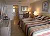 Master bedroom with new king size bed, flatscreen TV, beachfront balcony and adjoining bath with new tile shower