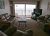 Living room with new carpeting , leather furniture, new flatscreen TV/DVD and large, Gulf front balcony.