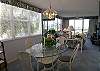 Beautiful, corner unit with large windows and sliding glass doors opening onto the bay front balcony.