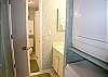 Second vanity area and washer/dryer.