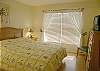 The guest bedroom has a queen size bed, and a tv/vcr.