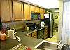 New cabinets, countertops and appliances in this fully equipped kitchen with easy pass-through to the dining area.