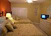 Guest Bedroom with two double beds, flatscreen TV &amp; adjoining bath