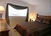 Master bedroom with queen size bed.