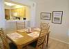 The dining room seats six, (one extra chair in each bedroom) and there is a pass-thru from the kitchen.
