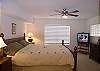 Master bedroom with king size bed and cable TV.