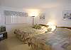 Bedroom with two queen sized beds and cable TV.