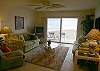 Living room with sleeper sofa, loveseat, recliner, TV and VCR/DVD combo.