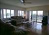 Wood floors and new furniture in the living room makes the condo feel so homey and comfortable.