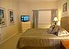 Second bedroom with queen size bed, 32 inch flatscreen TV and adjoining bath with tub/shower.