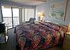 Master bedroom with king size bed, cable TV and sliding doors to the screened in Gulf front balcony.