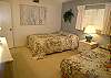 Guest bedroom with one double and one twin bed.