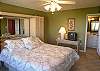 Master bedroom with queen size bed & TV