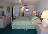 Master bedroom with king size bed, adjoining bath with tub/shower, cable TV and sliding doors to the Gulf front balcony.