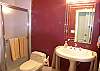 Main level guest bath with tile shower.