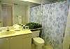 Guest bath with tile shower.
