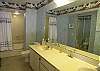 Master bath with large soaking tub with shower, double vanity &amp; a walk-in closet.