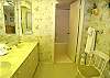 Master bath with double vanity and tub/shower.