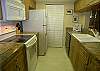 Kitchen with updated range, cabinets and countertops.