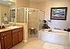 Master bath with two vanities, tile shower &amp; Jacuzzi Tub