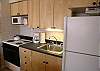 Kitchen with full size stove &amp; fridge