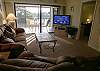 Sliding glass doors to the screened balcony