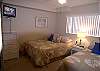 Bedroom with two double beds &amp; flatscreen TV
