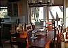 The dining table seats six. Bar stools also at the island.